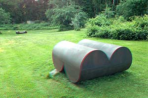 in 3D - cor-ten steel sculpture perpendicular cylinders 3